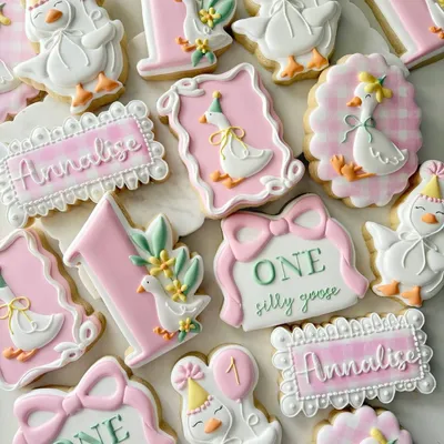 "One Silly Goose" first birthday cookie set for "Annalise" with goose characters wearing party hats, pink gingham patterns, and florals.